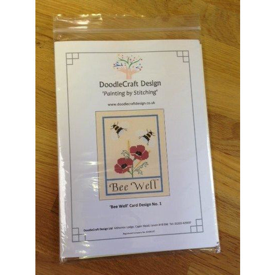A cross stitch design of Bee's and Poppies with a Bee Well message. Designed by DoodleCraft Design