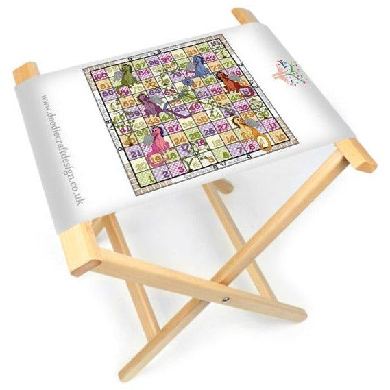 The DoodleCraft Design Dragons and Beanstalks games board printed onto canvas and made into a foldable board and stool